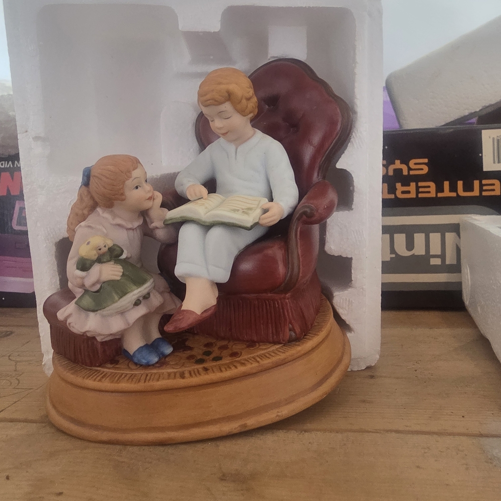 Avon Holiday Figurine with Burgundy and Blue Accents
